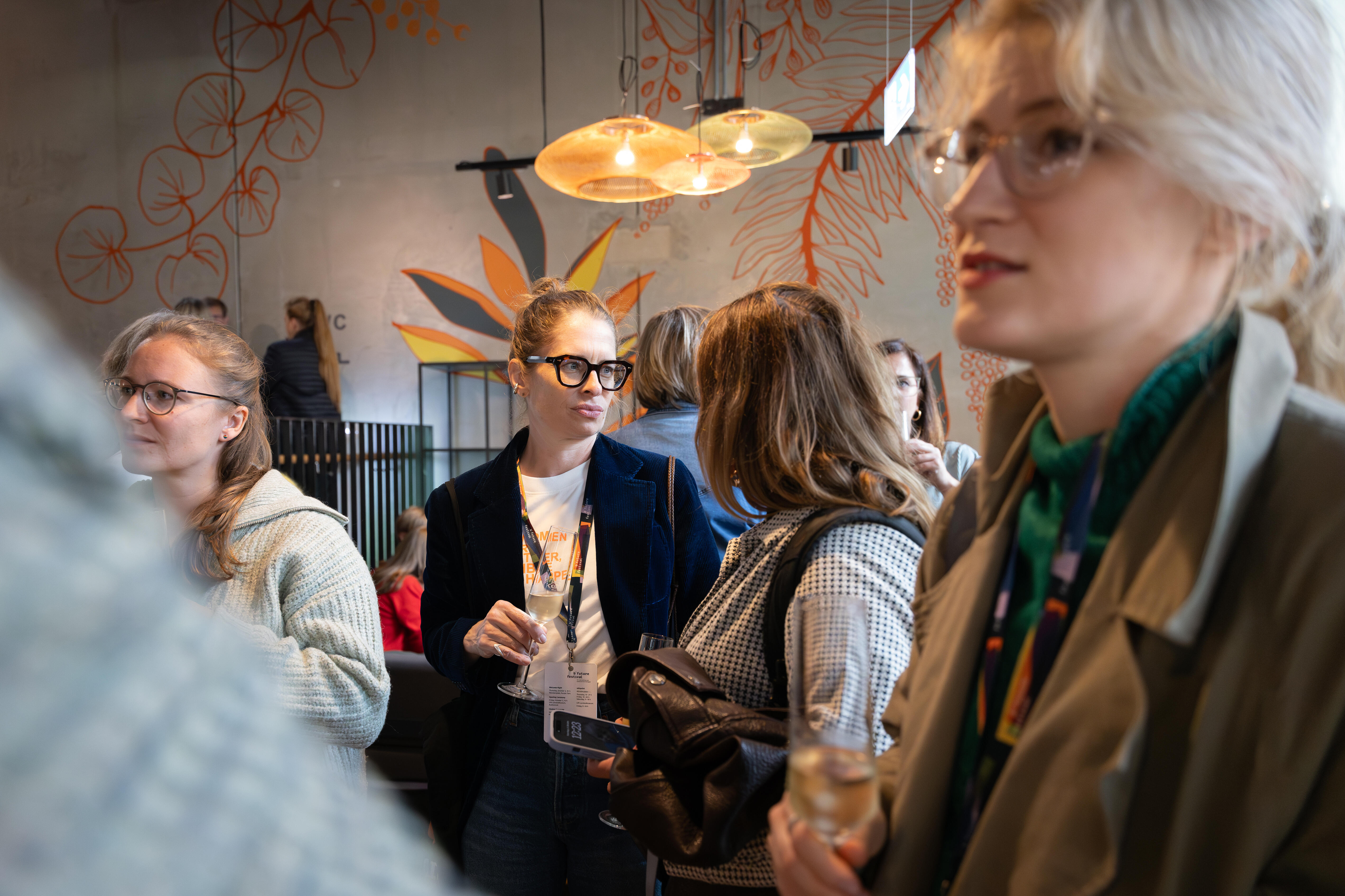Several people socializing together and engaged in conversation.