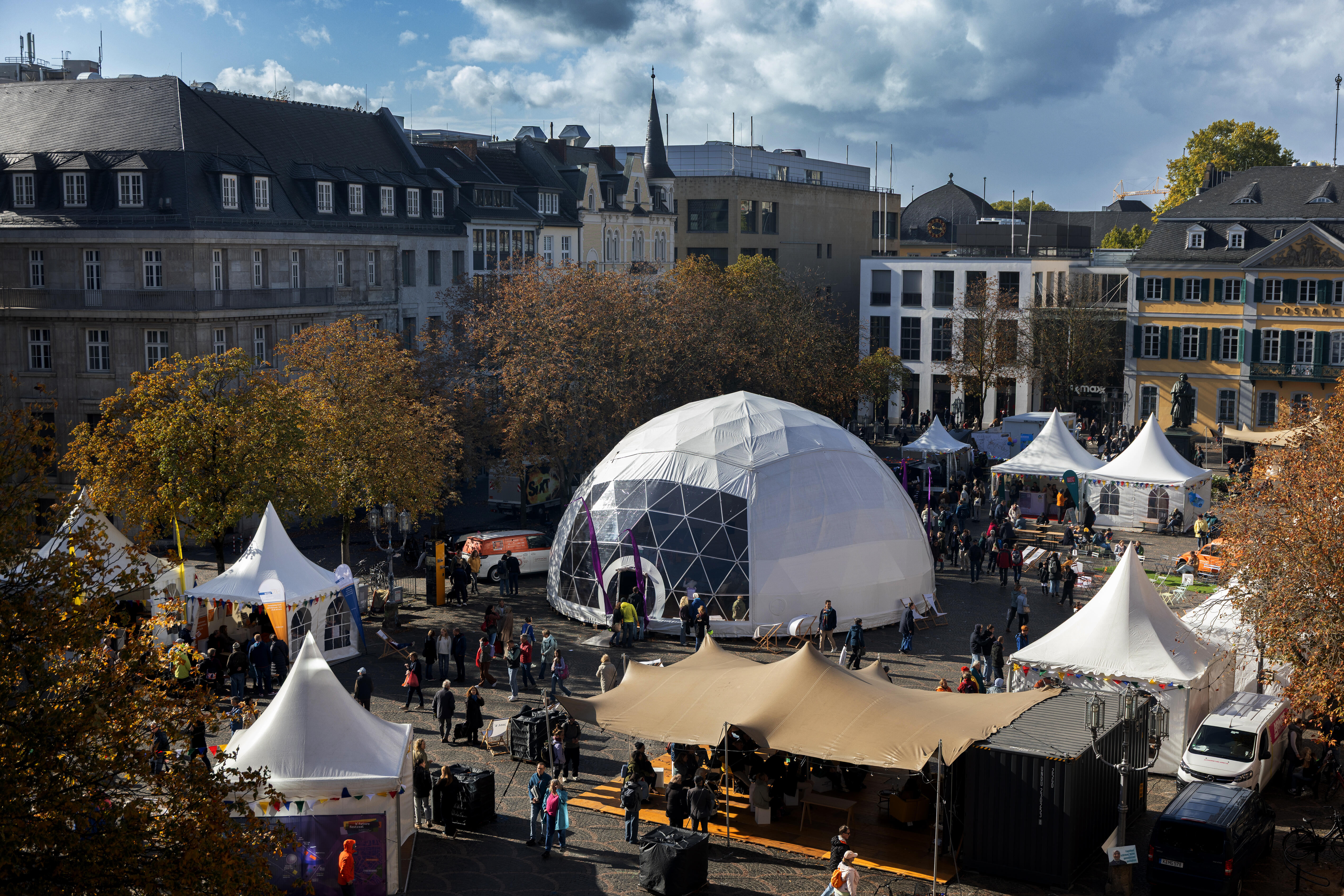 Bird’s-eye view of Münsterplatz with the b° future festival tent area and the dome tent at the center.